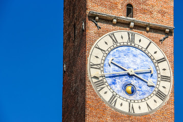 Vicenza, Italy. View of clock tower (Torre Bissara) at famous square (Piazza dei Signori) in Vicenza.
