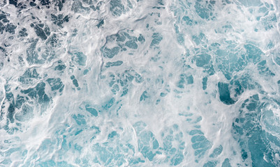 Sea foam moving in the ocean