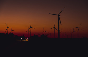 wind turbines at sunset