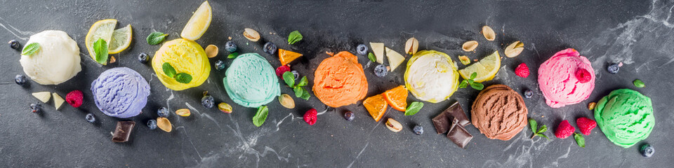Colorful pastel ice cream with waffle cones and various flavor ingredients, black marble...