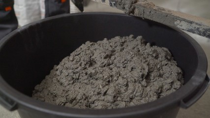 Construction mixer and bucket. construction mixer in the room where the floor will be repaired. Preparing floors for leveling