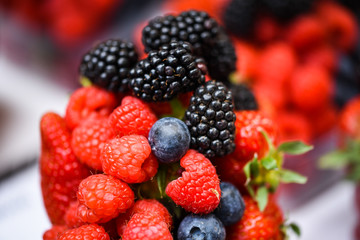 fresh berries close up - strawberries, blueberries, red berries, raspberry, black berries 