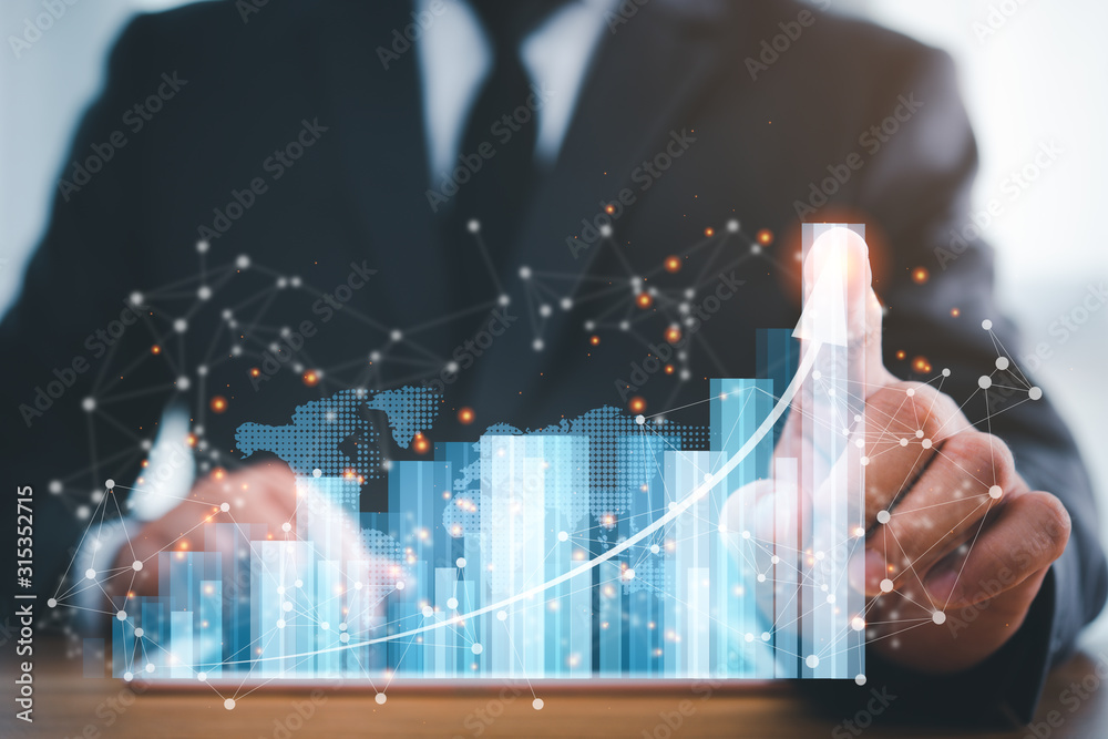 Poster businessman using tablet analyzing sales data and economic growth graph chart .e-commerce and networ