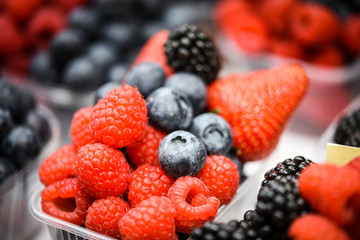 fresh berries close up - strawberries, blueberries, red berries, raspberry, black berries 