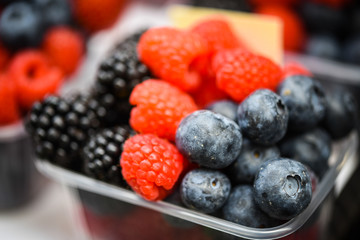 fresh berries close up - strawberries, blueberries, red berries, raspberry, black berries 