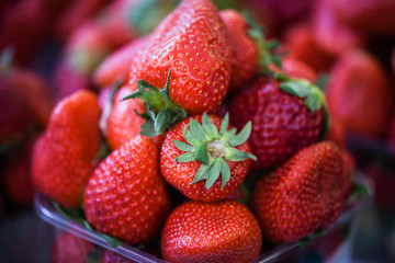fresh strawberries close up within the fruits market in Prague