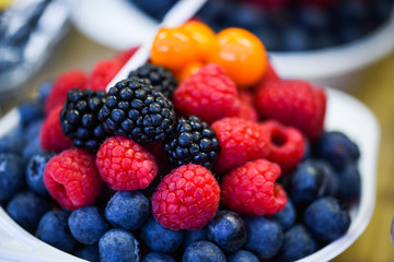 fresh berries close up - strawberries, blueberries, red berries, raspberry, black berries 