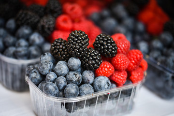 fresh berries close up - strawberries, blueberries, red berries, raspberry, black berries 