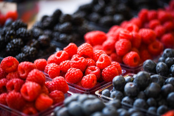 fresh berries close up - strawberries, blueberries, red berries, raspberry, black berries 
