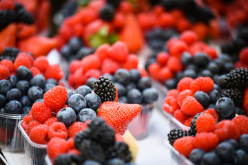 fresh berries close up - strawberries, blueberries, red berries, raspberry, black berries 