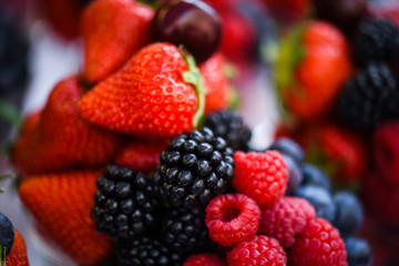 fresh berries close up - strawberries, blueberries, red berries, raspberry, black berries 