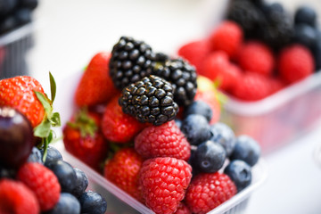 fresh berries close up - strawberries, blueberries, red berries, raspberry, black berries 