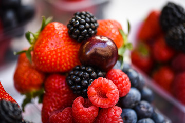 Obraz premium fresh berries close up - strawberries, blueberries, red berries, raspberry, black berries 