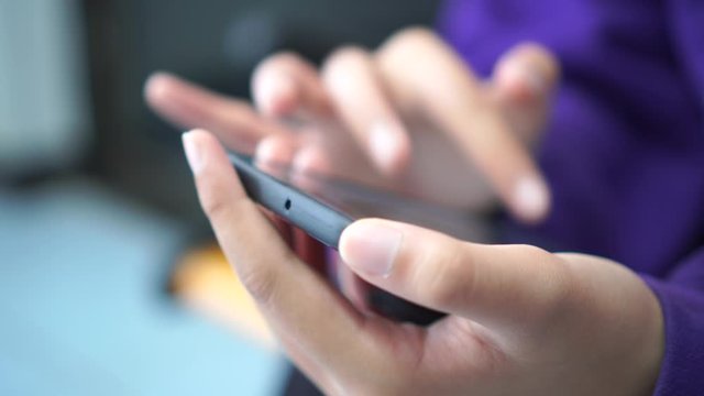 Digital Smartphone disruption concept, Hand holding mobile for searching information data internet at anywhere in office over blur background. Technology / internet of things for new generation