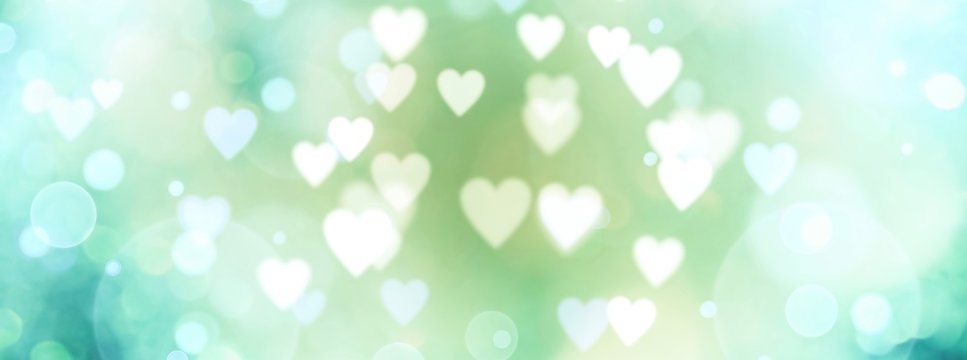 Abstract pastel background with hearts - blurred bokeh lights