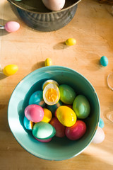 Coloring hard-boiled eggs easter tradition, naturally dyed eggs for easter holiday using natural ingredients, top view flat lay composition