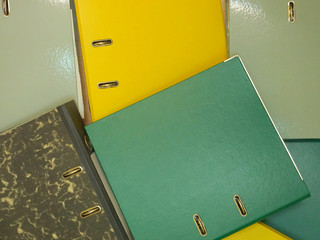 Plastic folders with documents. Multicolored stationery folders