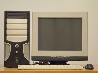 Old desktop computer. Retro vintage personal computer PC with keyboard and monitor