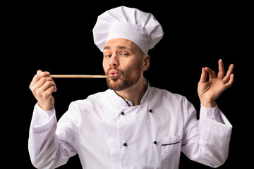 Professional Chef Man Tasting Food Approving Taste Standing, Studio Shot