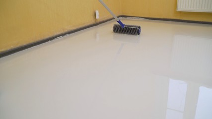 Special brush for leveling bulk floors. Jellied bulk floors Finishing works - Needle roller for...