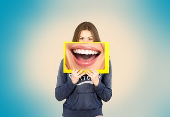 Woman holding frame with big smile