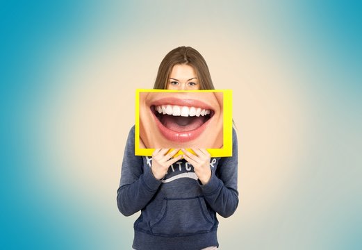 Woman holding frame with big smile