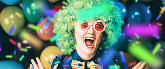 Portrait of beautiful party woman in wig and glasses (Carneval).