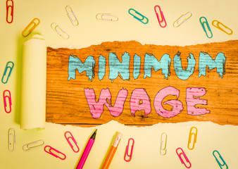 Word writing text Minimum Wage. Business photo showcasing the lowest wage permitted by law or by a...