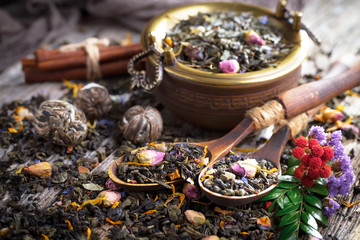 Dried leaf tea on old background