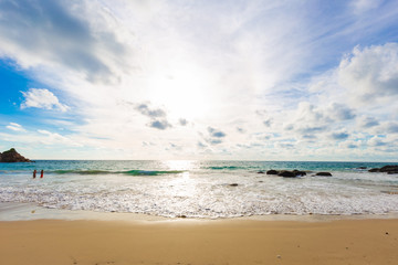 Beautiful sea wave on sandy beach evening sunset light