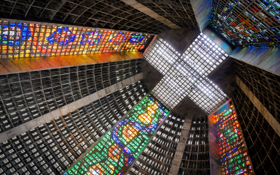 Rio de Janeiro Cathedral, Brazil, with its brutalist concrete structure interior decorated by brightly colored stained glass windows.