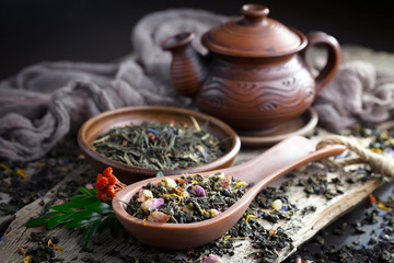 Dried leaf tea on old background