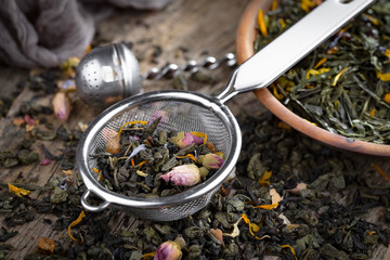 Dried leaf tea on old background