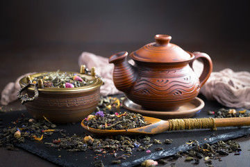 Hot tea in a cup on an old background.