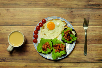 Still life with fried eggs, tomatoes, sandwiches, folk, cup