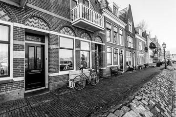Street in small town Hoorn in autumn, The Netherlands. Black and white image