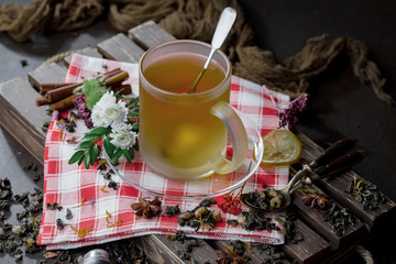 Tea hot drink on old background in composition on the table