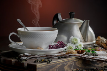 Tea hot drink on old background in composition on the table