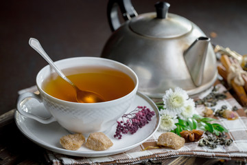 Tea hot drink on old background in composition on the table