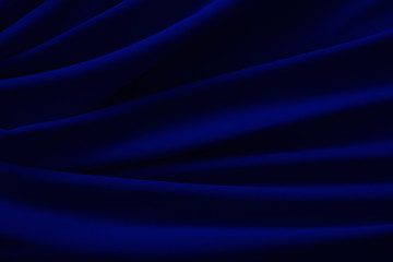 waves of blue satin fabric as background