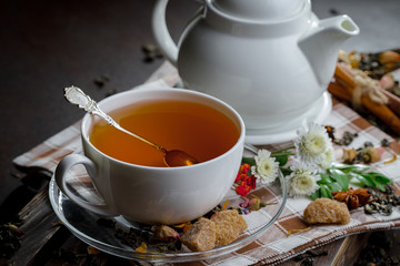 Tea hot drink on old background in composition on the table