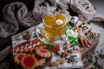 Tea hot drink on old background in composition on the table