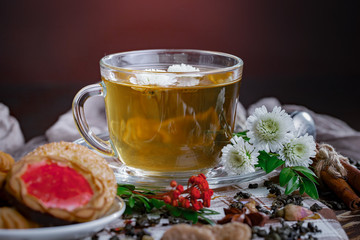 Tea hot drink on old background in composition on the table