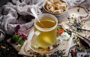 Tea hot drink on old background in composition on the table