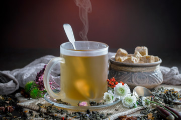 Tea hot drink on old background in composition on the table