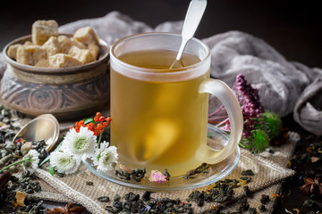 Tea hot drink on old background in composition on the table