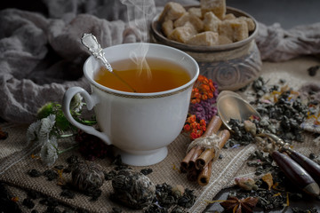 Tea in a cup on an old background