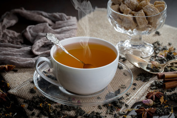 Tea hot drink on old background in composition on the table