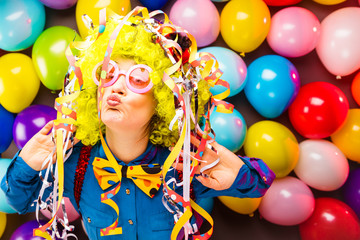 Portrait of beautiful party woman in wig and glasses (Carneval).