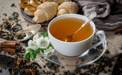 Tea hot drink on old background in composition on the table